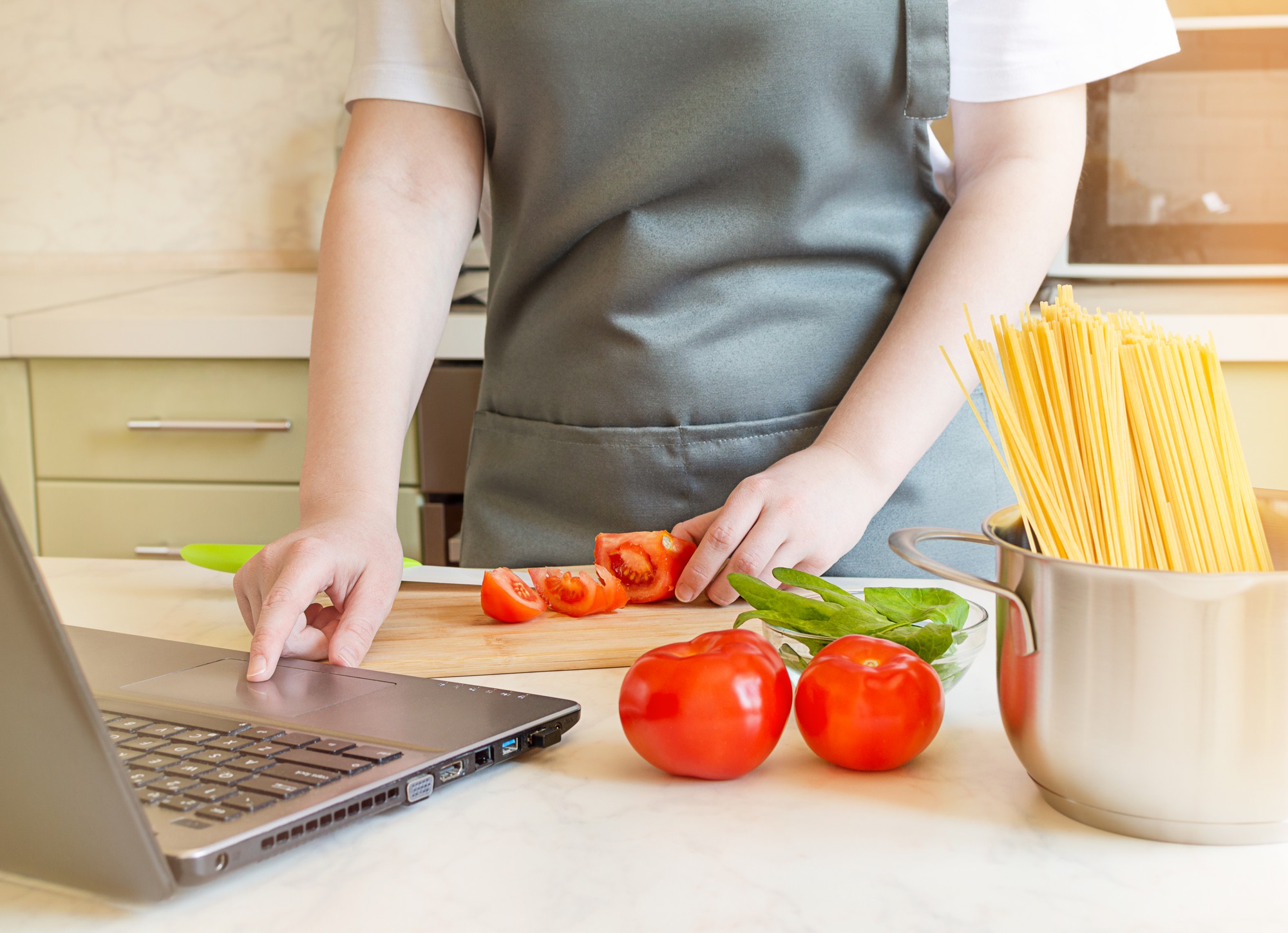 Student preparing ingredients in kitchen